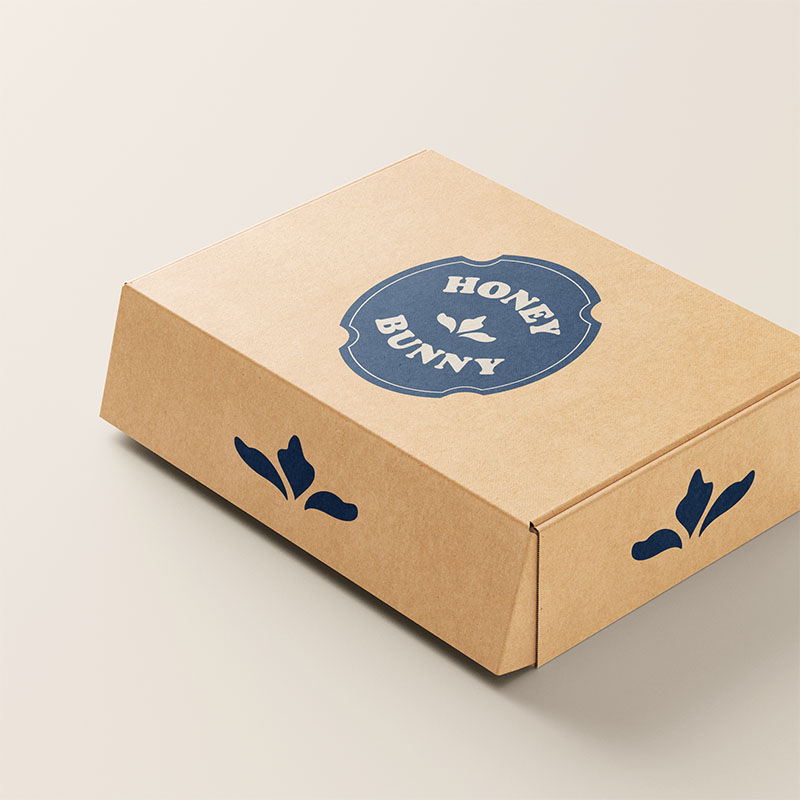 Take out box for Honey bunny bakery with logo on top and designs on the side